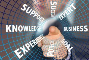 A finger pointing out essential business aspects