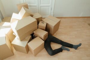 Brown cardboard boxes on brown wooden floor