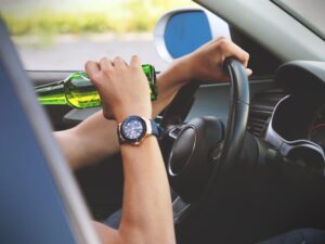 Person driving and drinking