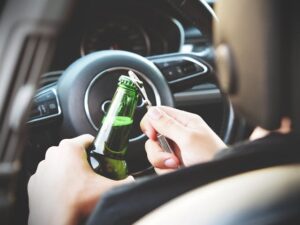 Opening bottle on car