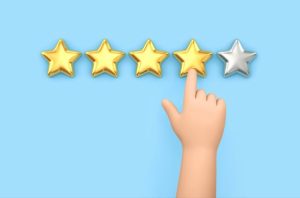 Hand selecting a customer star rating, representing MotoAssure Administration reviews and reputation